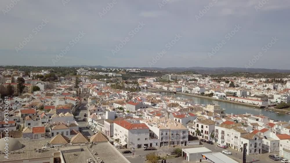Aerial view of charming Tavira with roman bridge in sunny day, Portugal Aerial view of charming Tavira with roman bridge in sunny day, Portugal