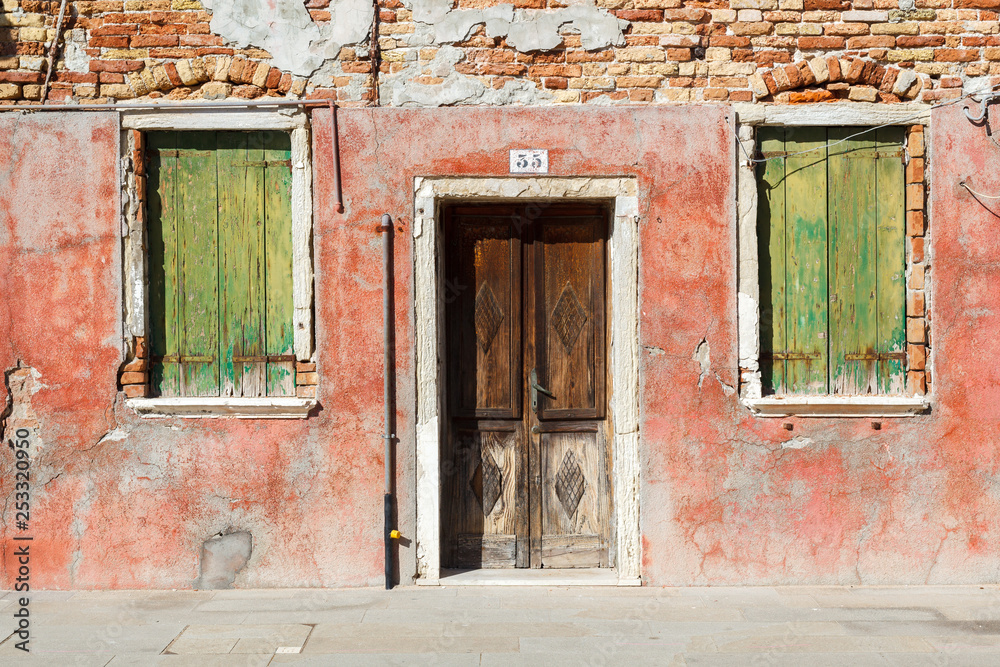 Burano, Venezia, Italy. Details of the windows and doors of the colorful houses in Burano island Burano, Venezia, Italy. Details of the windows and doors of the colorful houses in Burano island