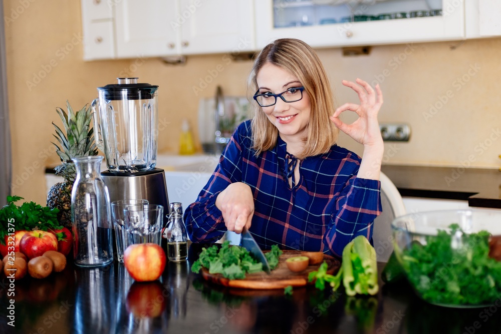 Young woman preparing healthy meal in kitchen