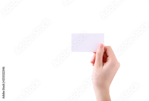 Woman holding white business card in hand isolated on a white background.