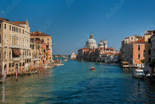 Grand Canal and Basilica Santa Maria della Salute, Venice, Italy. The Grand Canal of Venice near the Academia Bridge on a beautiful sunny summer day. 