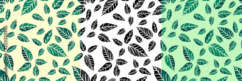 Seamless pattern with leaves of green and yellow and white leaves on one sheet. Drawn by hand.