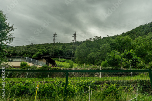 Italy,La Spezia to Kasltelruth train, a close up of a lush green field next to a wire fence