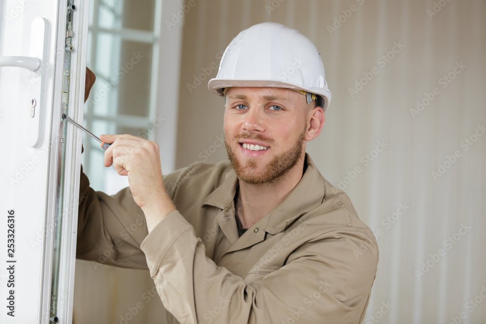happy builder in working uniform