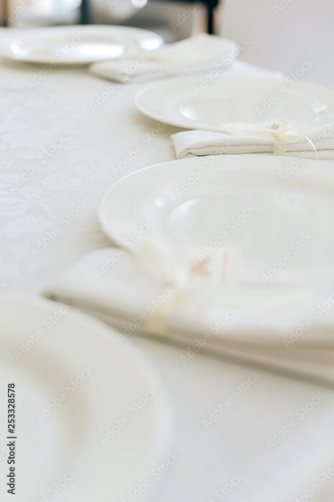 Tables set for an event party or wedding reception. luxury elegant table setting dinner in a restaurant. glasses and dishes. Tables set for an event party or wedding reception. luxury elegant table setting dinner in a restaurant. glasses and dishes.