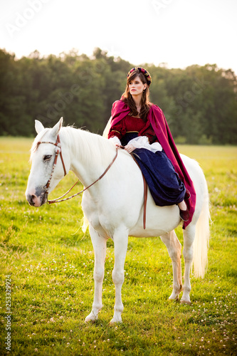 Medieval Princess Sitting on a White Horse