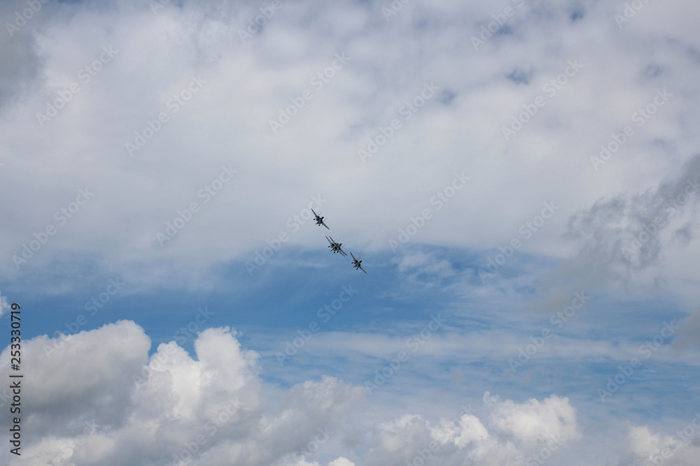 Four aircraft combat fighters SU-34 military fighters flying in the sky a great strong powerful