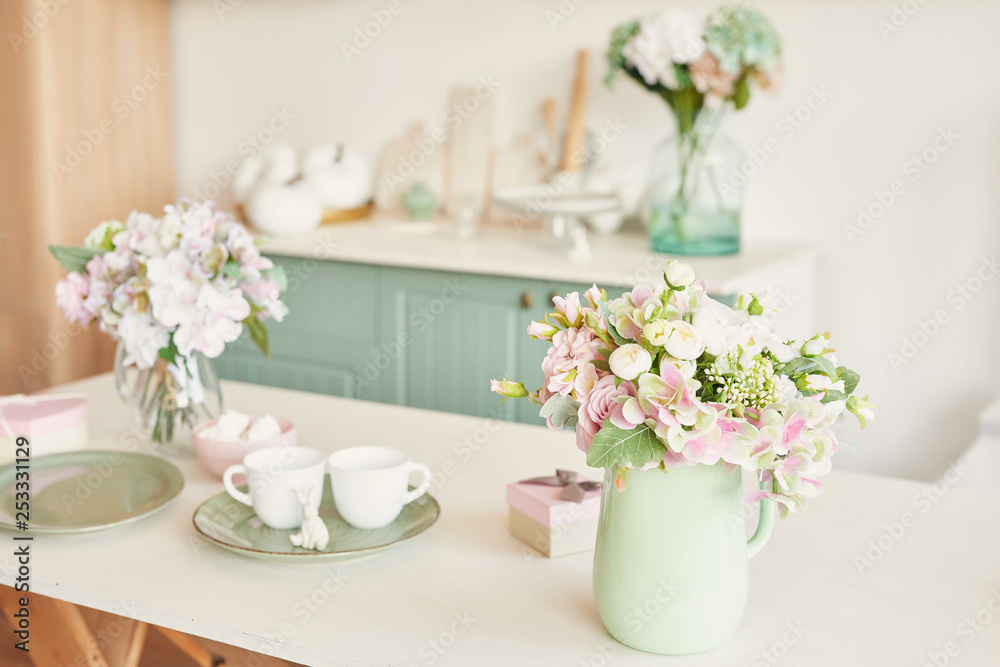 bouquet of flowers in a vase on the table in the kitchen bouquet of flowers in a vase on the table in the kitchen