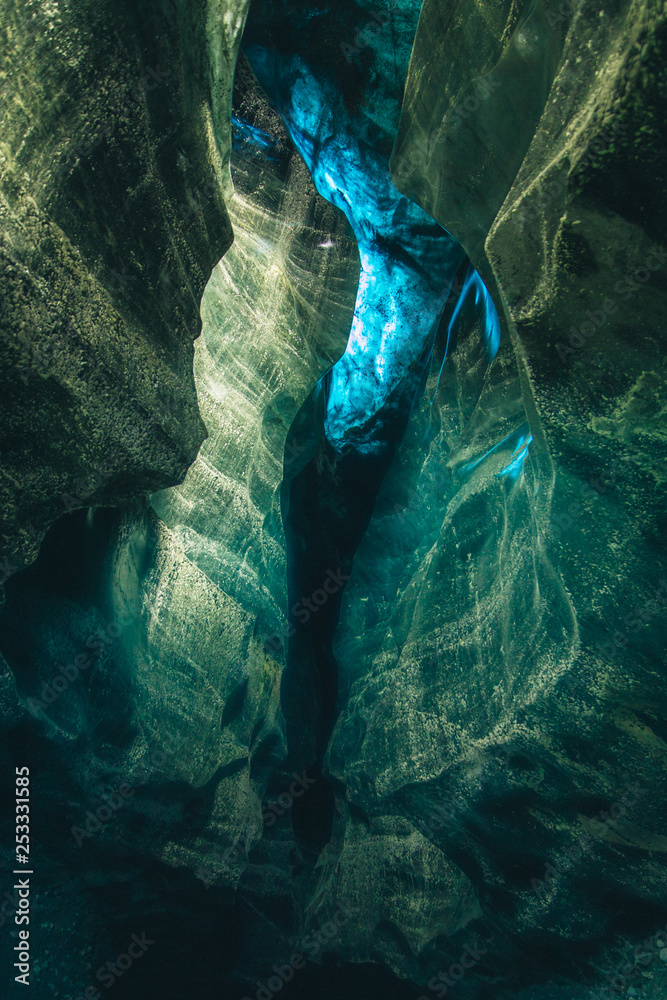 beautiful crystal clear blue ice cave Iceland vatnajokull national park glacier 