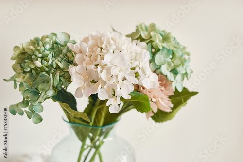 bouquet of flowers in a vase on the table in the kitchen