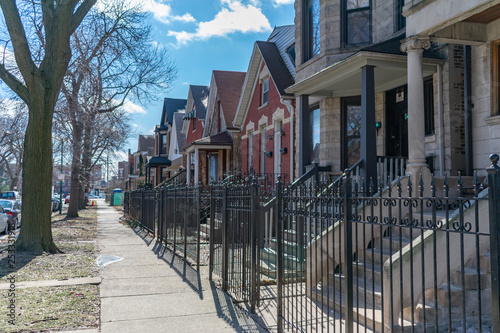 A Row of Fenced In Homes in Logan Square Chicago © James