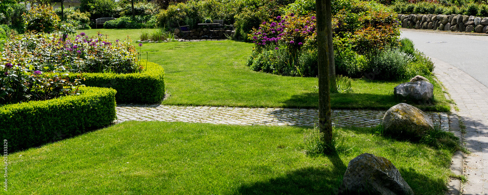 Garden path to the street with lawn