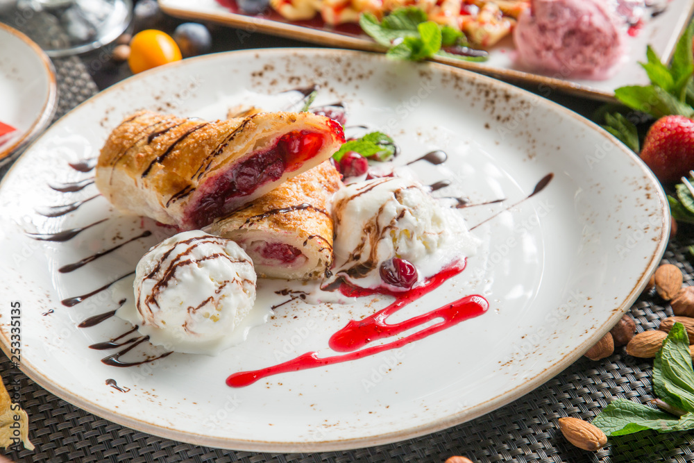 Espresso and homemade ice cream in the restaurant: strawberry, vanilla, citrus. Delicious and fresh dessert. Espresso and homemade ice cream in the restaurant: strawberry, vanilla, citrus. Delicious and fresh dessert.