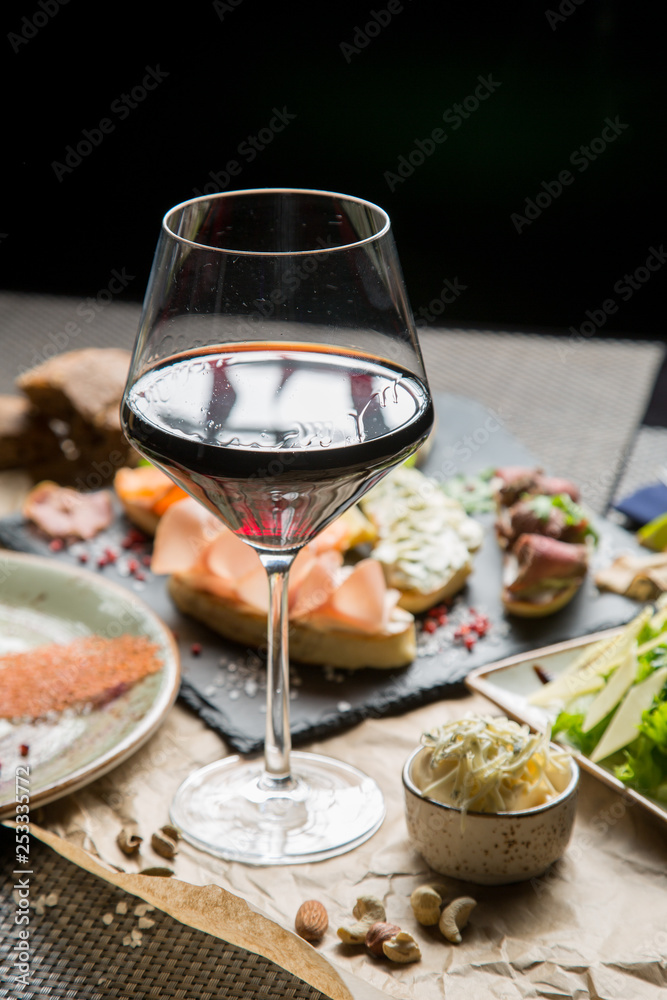 glass of wine with a variety of snacks. Georgian menu, Georgian restaurant glass of wine with a variety of snacks. Georgian menu, Georgian restaurant