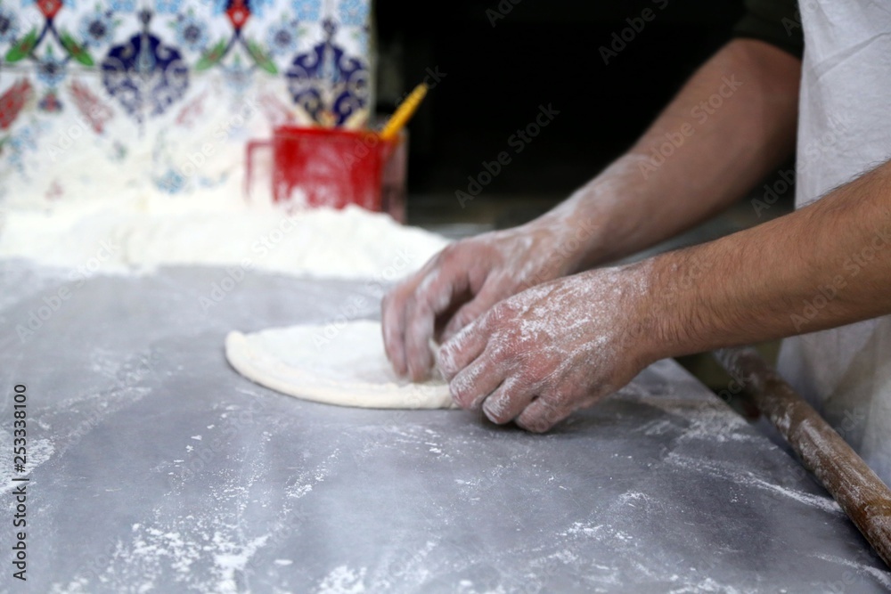 pide master makes pide with meat and vegetables .artvin/turkey