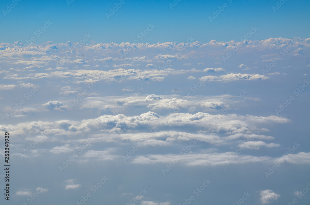 The sky with clouds view from airplane window The sky with clouds view from airplane window