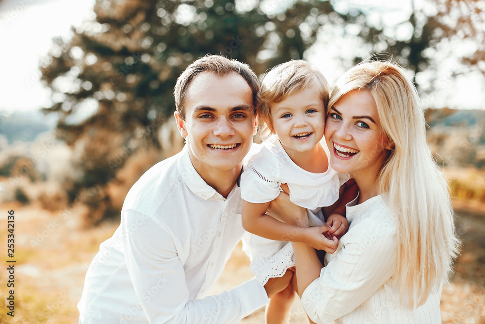 Cute family playing in a summer park Cute family playing in a summer park