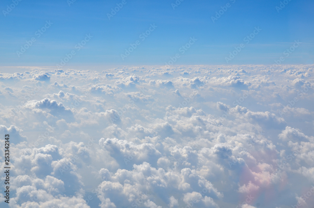 The sky with clouds view from airplane window The sky with clouds view from airplane window