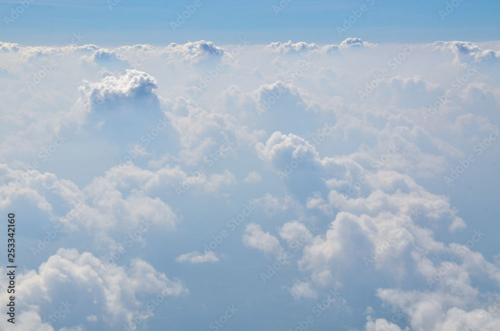 The sky with clouds view from airplane window The sky with clouds view from airplane window