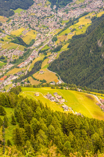 Alpe di Siusi, Seiser Alm with Sassolungo Langkofel Dolomite, a close up of a lush green hillside
