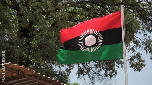Malawi flag blowing in wind photo