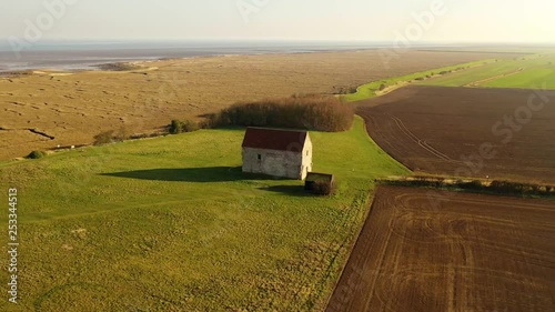 Aerial sequence featuring The Chapel of St Peter-on-the-Wall, Bradwell-on-Sea, Essex. It is a Grade I listed building and among the oldest largely intact Christian churches in England, built in 660.
