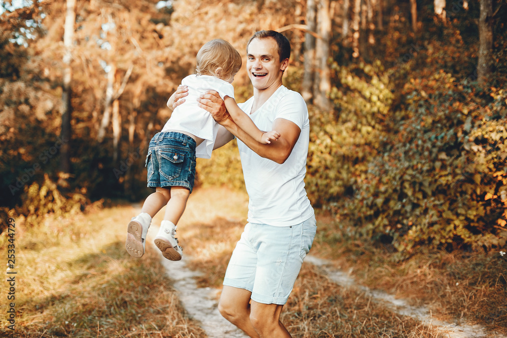 Fototapeta premium Cute family playing in a summer park