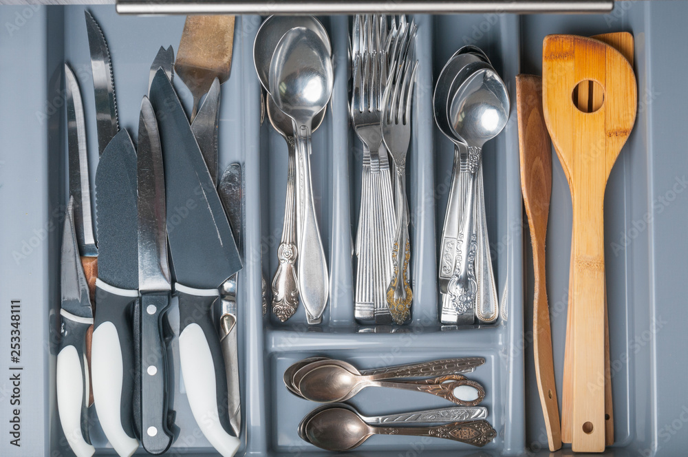 Opened kitchen drawer with cutlery. Top view Stock Photo | Adobe Stock