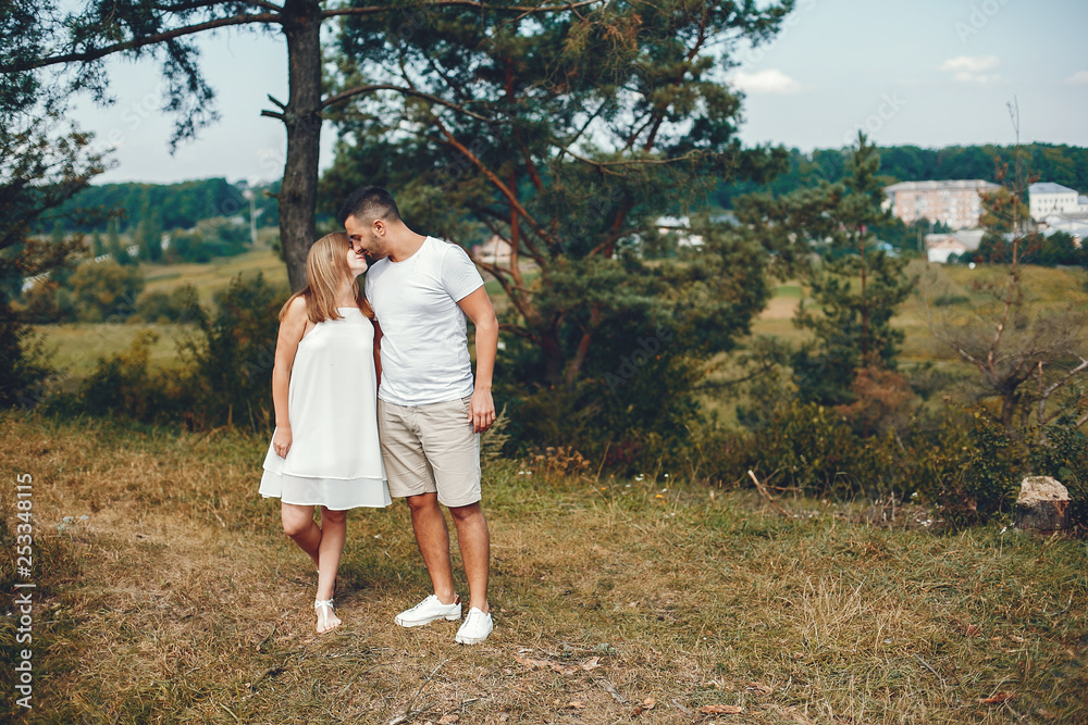 Beautiful couple spend time in a summer park Beautiful couple spend time in a summer park