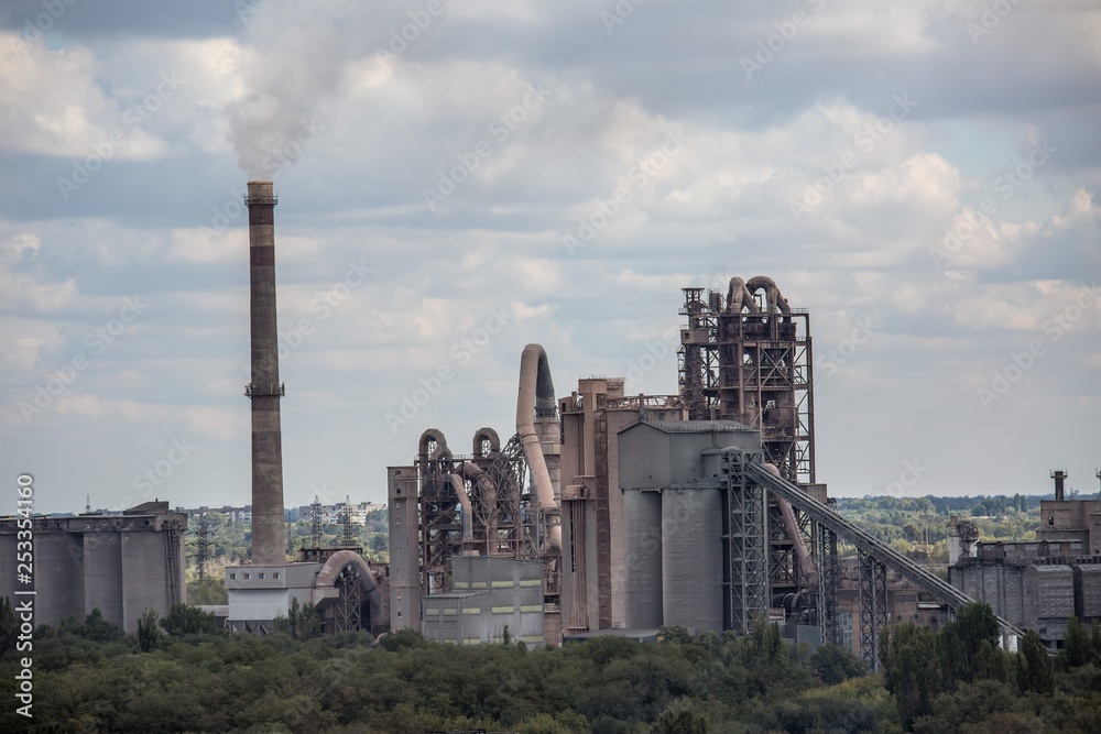 landscape, panorama, view of factory slums with metal hulls and machines for the production of the coking industry, smoking pipes and reconstruction of a plant in Ukraine