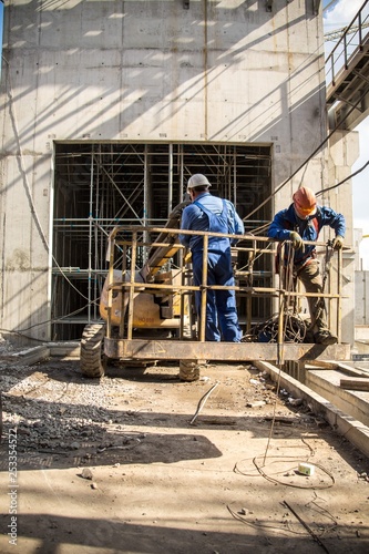 factory workers at Koksokhim, welders are engaged in the construction and installation of metal structures on high ground and in special working conditions