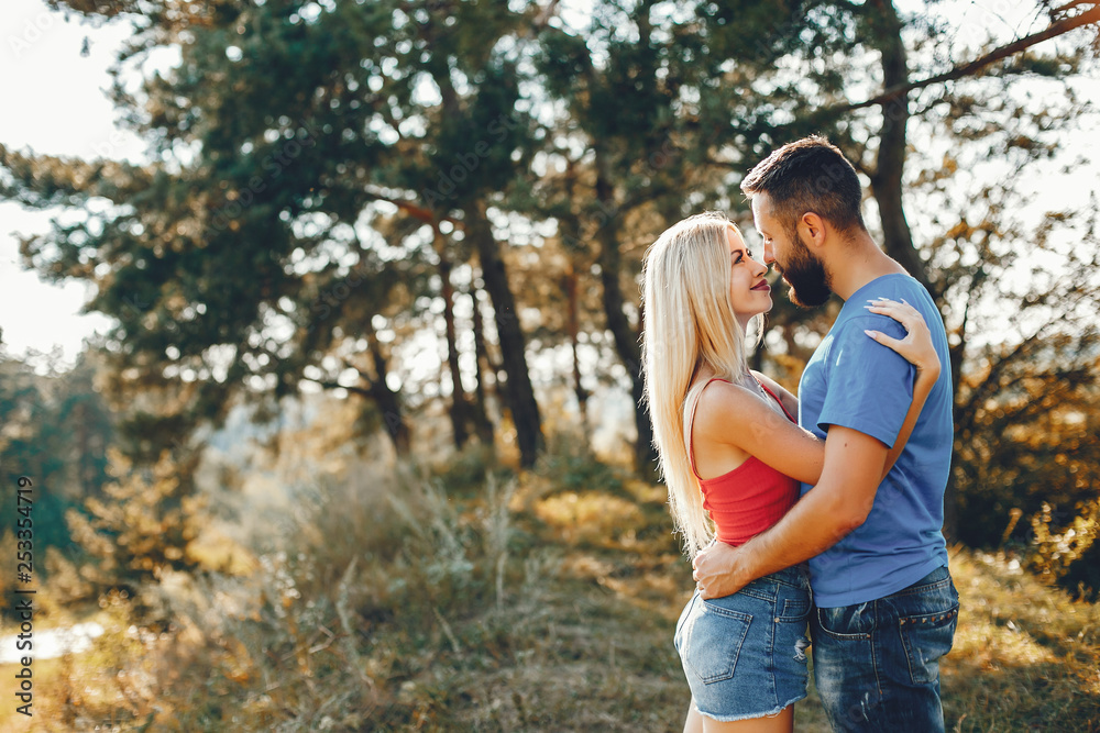 Beautiful couple spend time in a summer park Beautiful couple spend time in a summer park