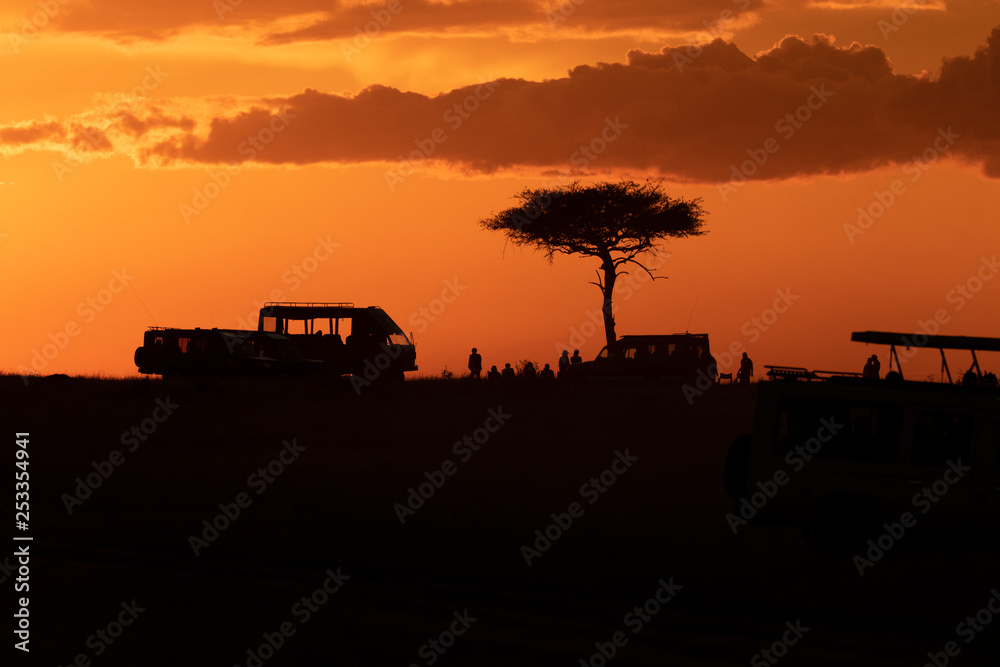 Fototapeta premium A sundowner party in the evening inside Masai Mara National Reserve to end a beautiful day of safari