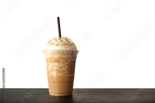 Cappuccino blended in plastic cup. Served with whipped cream. Refreshment drink. Favorite caffeine beverage.
