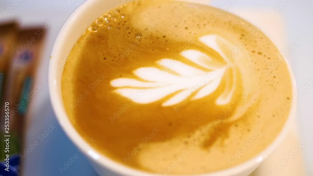 Coffee latte art being made with micro foam on a coffee cappuccino beverage mug
(close up shot) Coffee latte art being made with micro foam on a coffee cappuccino beverage mug
(close up shot)
