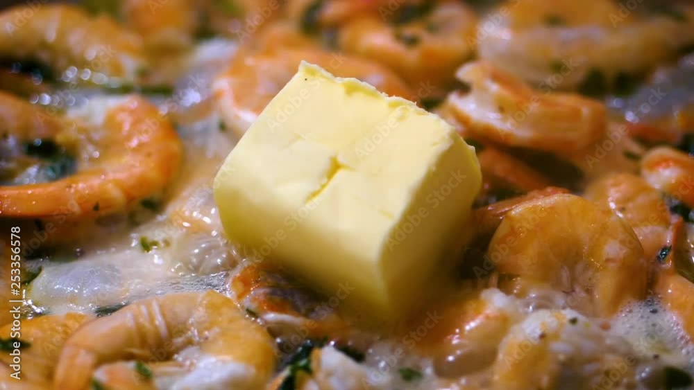 Chunk of butter melting on frying king shrimps delicacy in a saute pan
(close up shot) (slow motion shot) Chunk of butter melting on frying king shrimps delicacy in a saute pan
(close up shot) (slow motion shot)