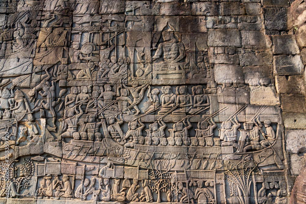 Relief on the wall of gallery of Bayon temple in Angkor Thom. Cambodia