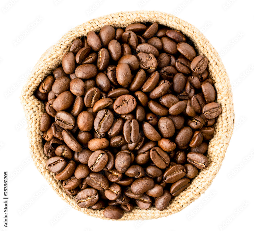 Coffee beans in a bag on a white. The form of the top. Coffee beans in a bag on a white. The form of the top.