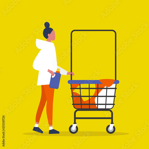 Colourful clothes in a trolley. Self service. Young female character rolling a laundry cart. Laundromat. Detergent. Daily chores concept.