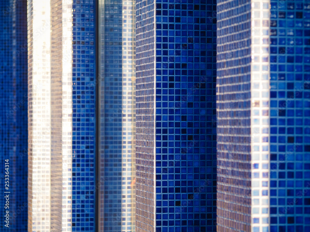 Small blue tiles on the wall outdoors