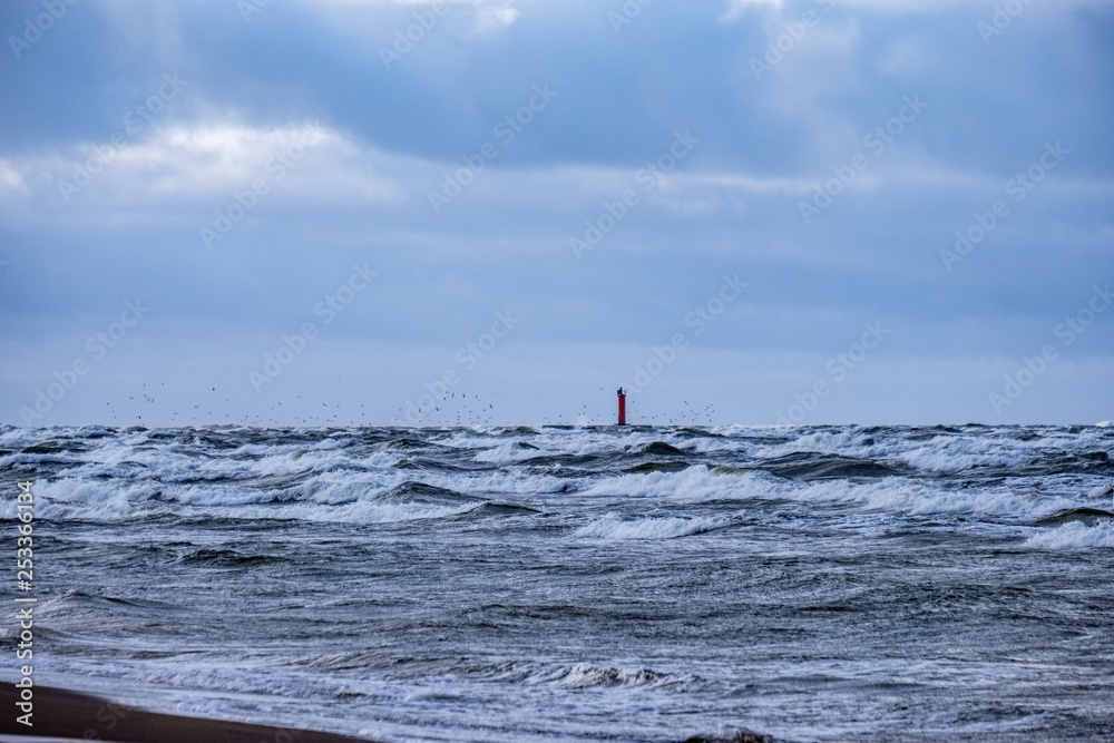 moderate storm in baltic sea near lighthouse