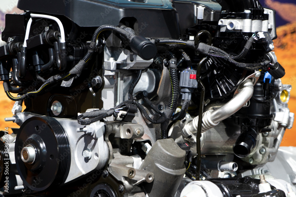Car engine part, concept of modern vehicle motor and cut metal car engine part details Car engine part, concept of modern vehicle motor and cut metal car engine part details