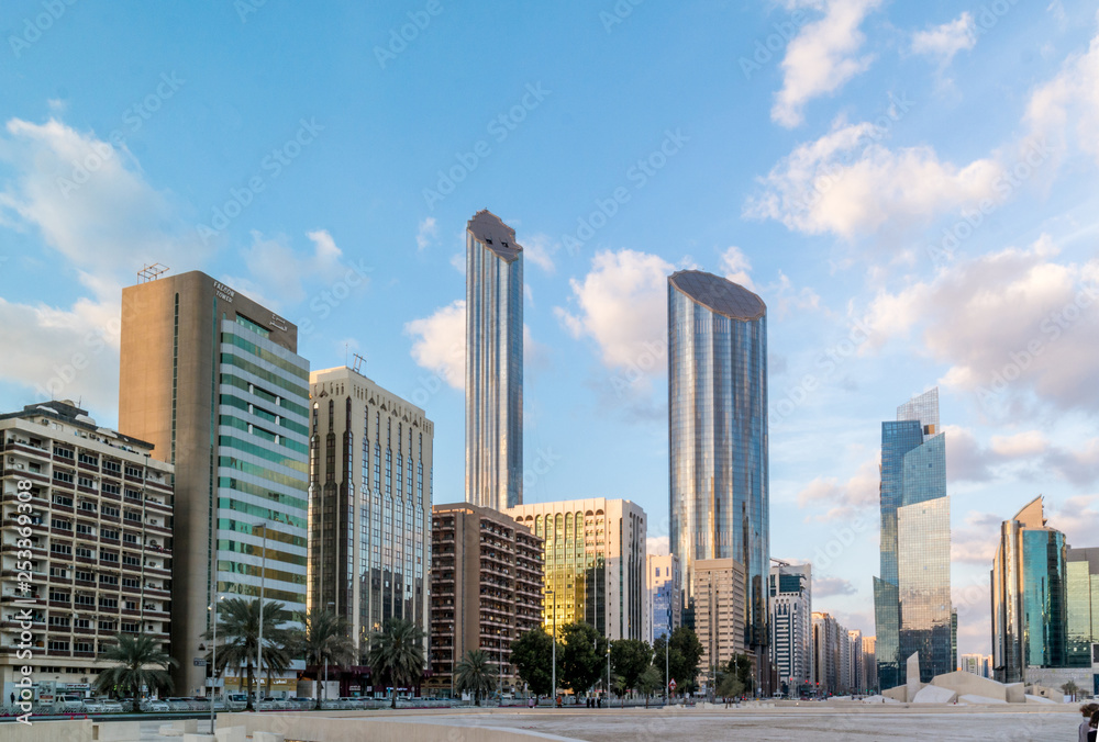 Modern city architecture and famous skyscrapers of Abu Dhabi skyline with beautiful clouds, World Trade Center UAE
