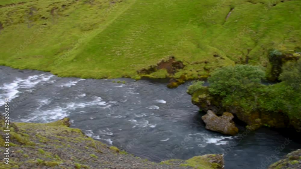 View of cascade of small waterfalls near huge Skogarfoss waterfall on South Iceland View of cascade of small waterfalls near huge Skogarfoss waterfall on South Iceland