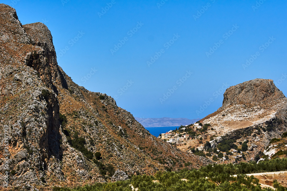Rocky peak and olive trees on the island of Crete, Greece