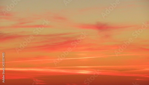 Natural fiery orange pink sunset background in the sky