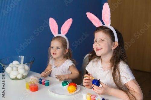  Girls paint easter eggs