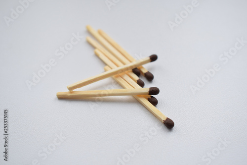 Scattered matches on a white background