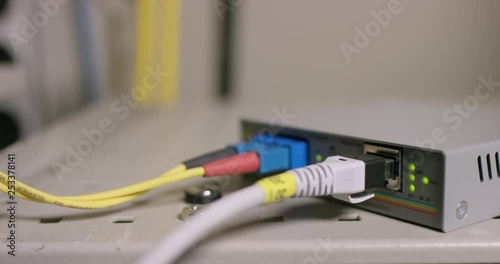 Backside of old cable modem with flickering lights