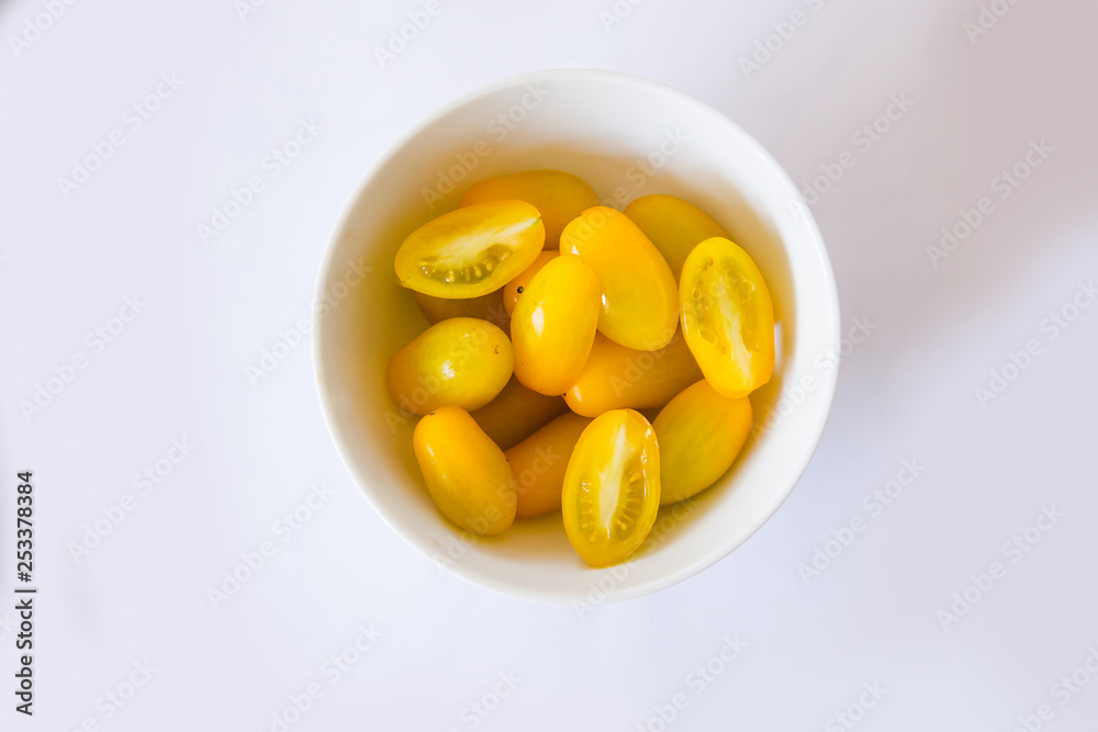 Exotic tomatoes rosa yellow tomatoes on a white background Exotic tomatoes rosa yellow tomatoes on a white background